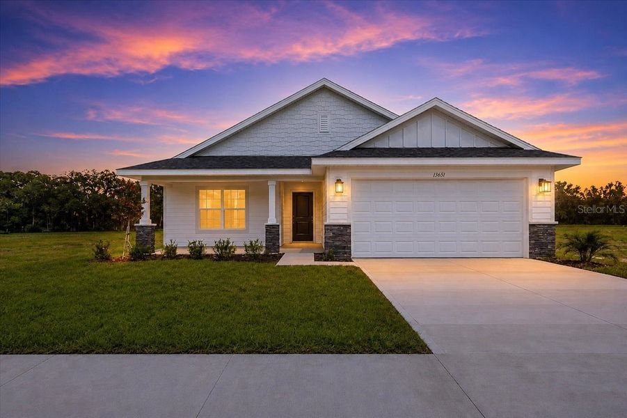 Front exterior of a new home in Kirkland Farms, Alachua, FL, highlighting curb appeal (Image 23). Front exterior of a new home in Kirkland Farms, Alachua, FL, highlighting curb appeal (Image 23).