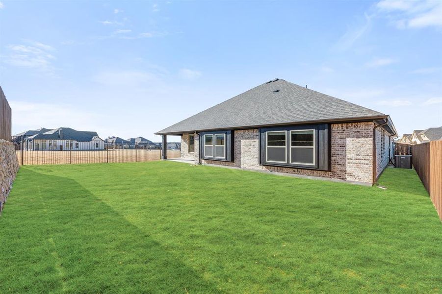 Exterior details and patio area of a home in Parks at Panchasarp Farms, Burleson (Image 4).