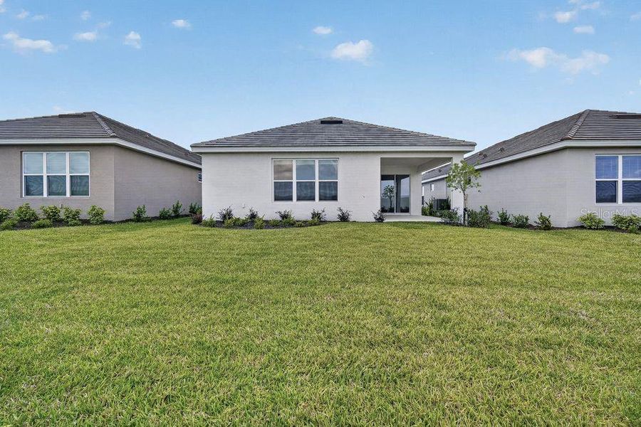 Exterior details and patio area of a home in Coasterra Community Group Page, Palmetto (Image 4).
