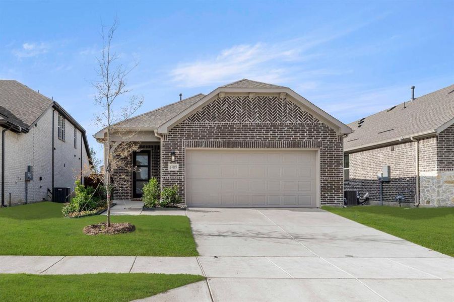 Front exterior of a new home in Creekview Fossil Ridge, Pilot Point, TX, highlighting curb appeal (Image 1).