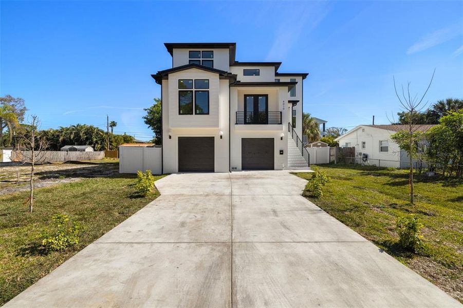 Front exterior of a new home in , St. Petersburg, FL, highlighting curb appeal (Image 1). Front exterior of a new home in , St. Petersburg, FL, highlighting curb appeal (Image 1).