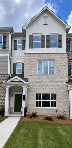 Front exterior of a new home in Townes at South Main, Kennesaw, GA, highlighting curb appeal (Image 2). Front exterior of a new home in Townes at South Main, Kennesaw, GA, highlighting curb appeal (Image 2).