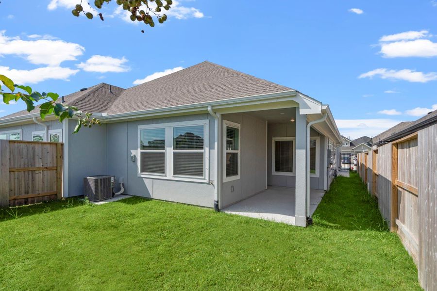 Exterior details and patio area of a home in Meridiana, Iowa Colony (Image 3).