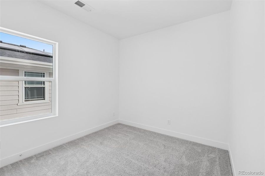 Spacious, unfurnished interior of a new home in Painted Prairie Cottage, Aurora (Image 29).