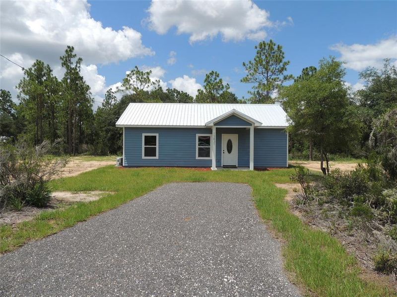 Front exterior of a new home in , Williston, FL, highlighting curb appeal (Image 15).