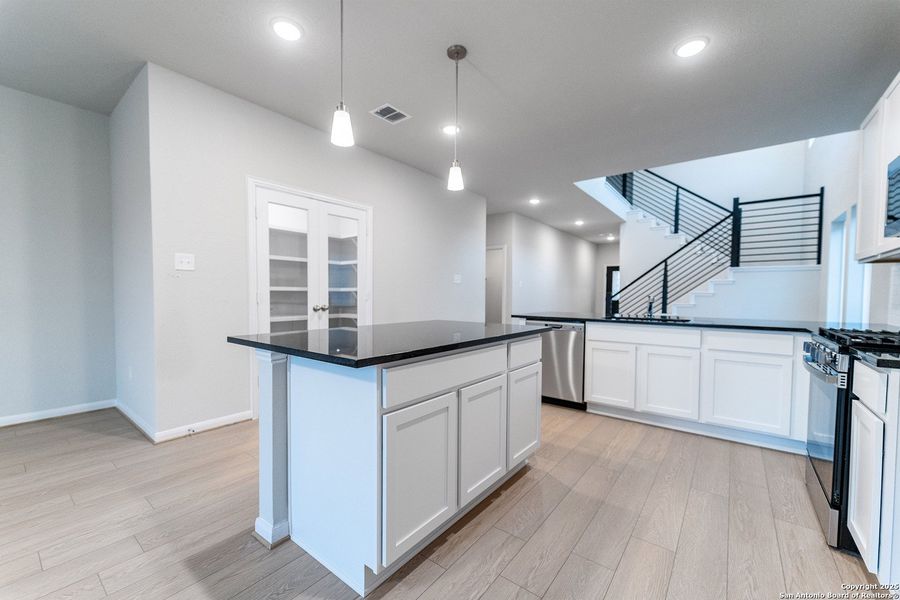 Furnished interior view inside a new home in Hennersby Hollow, San Antonio (Image 7).