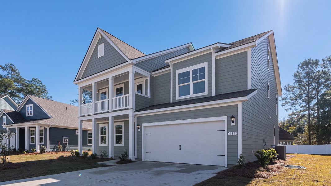 Front exterior of a new home in Eden Springs, Longs, SC, highlighting curb appeal (Image 22). Front exterior of a new home in Eden Springs, Longs, SC, highlighting curb appeal (Image 22).