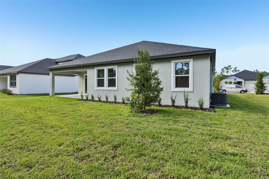 Exterior details and patio area of a home in Ridgehaven - Reserve Series, Ormond Beach (Image 3).