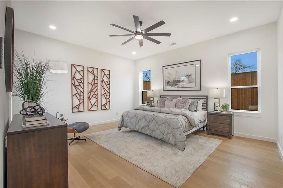 Bedroom with light wood-type flooring and ceiling fan