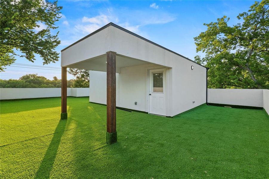 Back of property featuring an outbuilding Back of property featuring an outbuilding