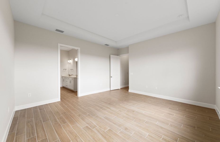 Owner's private suite featuring a drop tray ceiling