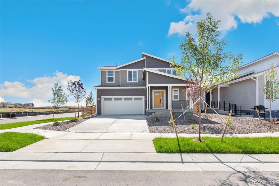 Front exterior of a new home in Legato, Commerce City, CO, highlighting curb appeal (Image 22).