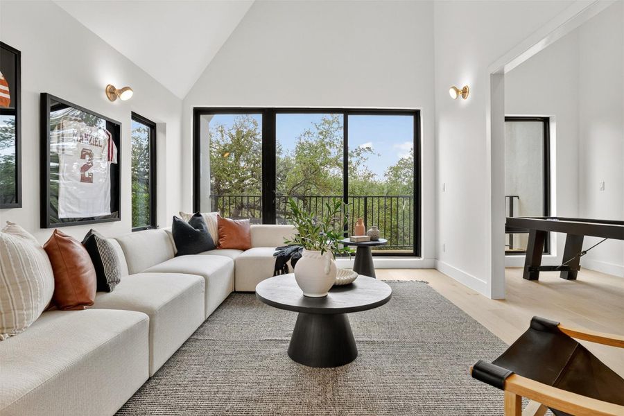Vaulted ceilings in the game room featuring a sink, cabinets, wine fridge and your own covered patio to admire your large backyard. Vaulted ceilings in the game room featuring a sink, cabinets, wine fridge and your own covered patio to admire your large backyard.