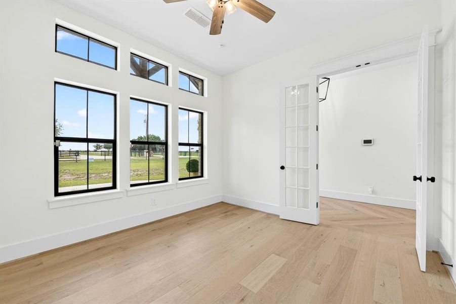 Home office with wall of windows to enjoy the gorgeous views. This room does offer a closet and could be a bedroom if needed Home office with wall of windows to enjoy the gorgeous views. This room does offer a closet and could be a bedroom if needed
