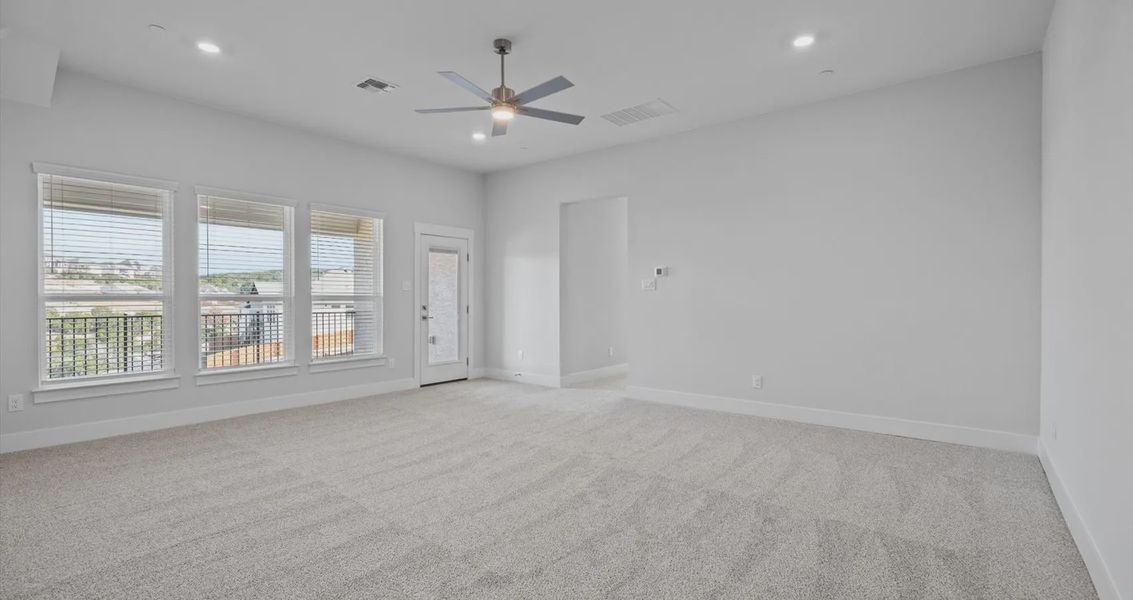 Representative unfurnished interior of a home built from the Raegan by Chesmar Homes in Sweetwater, Austin (Image 11).