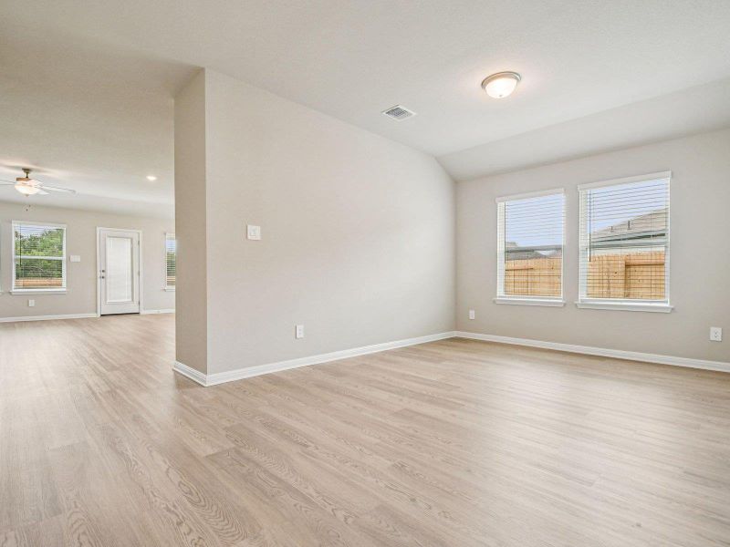 Spare room featuring ceiling fan and light wood-style floors Spare room featuring ceiling fan and light wood-style floors