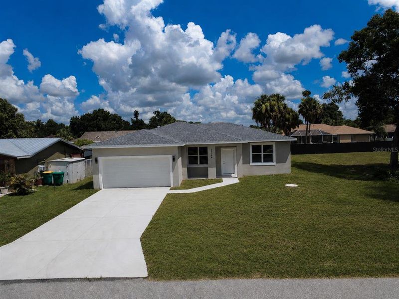 Front exterior of a new home in , Port Charlotte, FL, highlighting curb appeal (Image 24). Front exterior of a new home in , Port Charlotte, FL, highlighting curb appeal (Image 24).