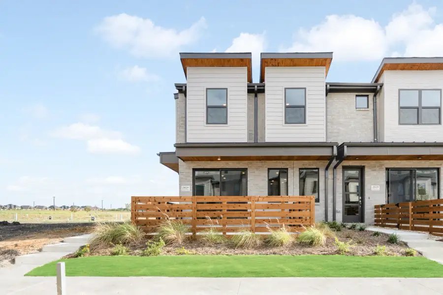 Front exterior of a new home in Ten Mile Creek, Celina, TX, highlighting curb appeal (Image 26).