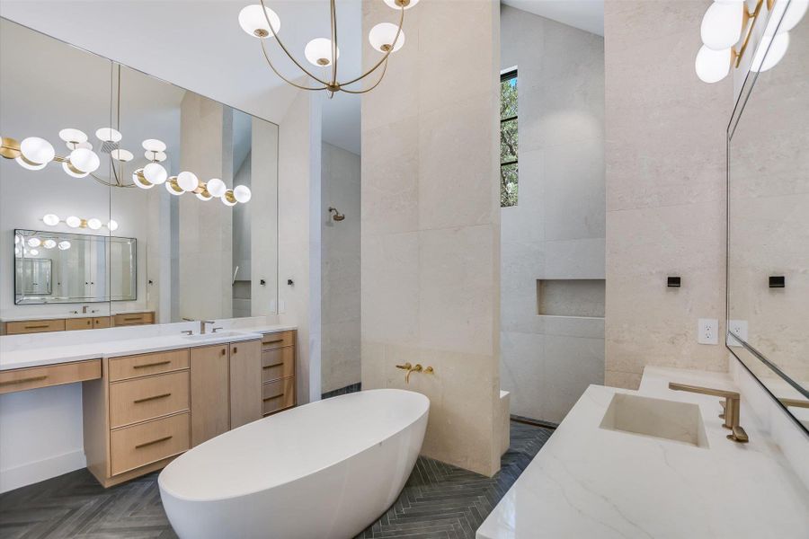 Indulge in a tranquil retreat with a freestanding soaking tub and dual vanities, perfect for unwinding.