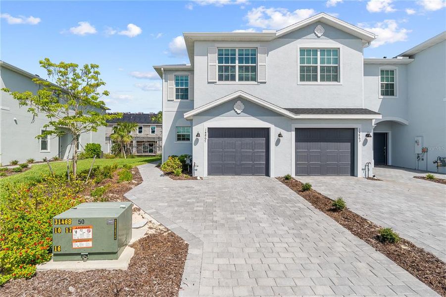 Front exterior of a new home in , Punta Gorda, FL, highlighting curb appeal (Image 24).