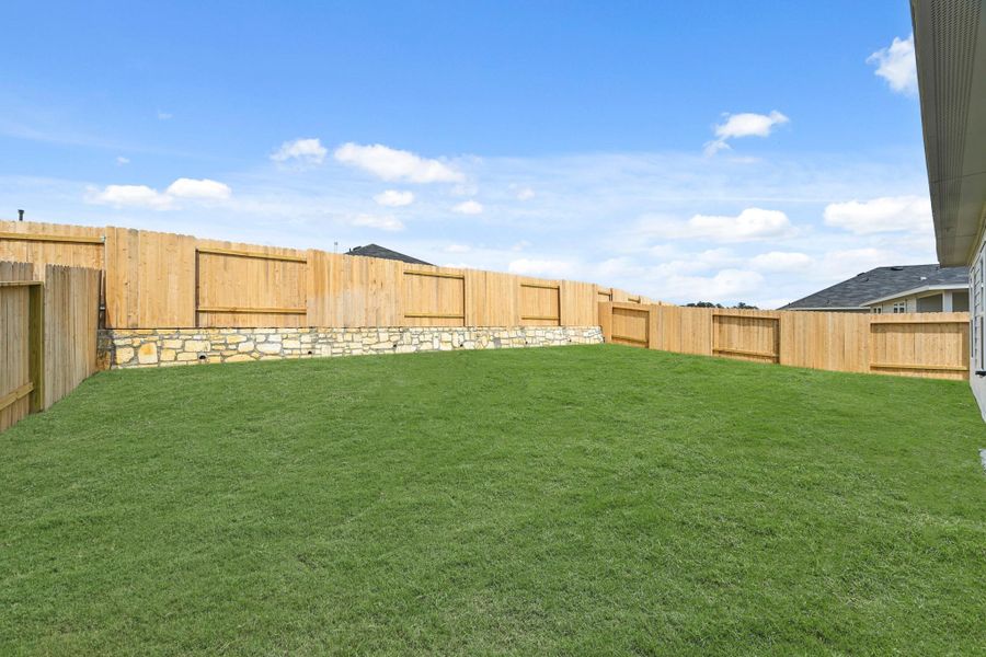 Exterior details and patio area of a home in Grand Pines, Magnolia (Image 15).