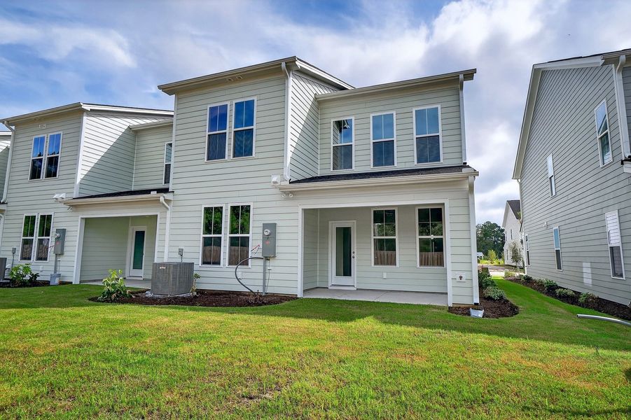 Front exterior of a new home in Grand Park, Leland, NC, highlighting curb appeal (Image 18). Front exterior of a new home in Grand Park, Leland, NC, highlighting curb appeal (Image 18).