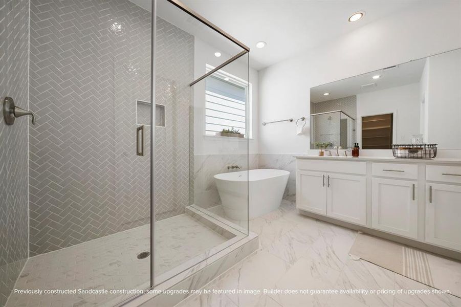 Spa-Style Shower – Experience luxury in the glass-enclosed walk-in shower, featuring elegant tile and premium fixtures for a serene start or end to your day.