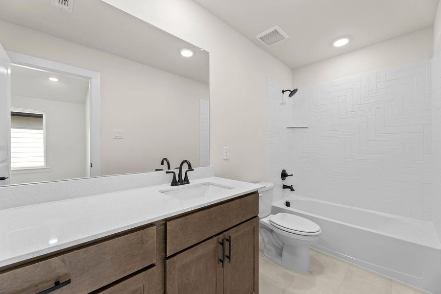 Furnished interior view inside a new home in Cottage Collection at Harvest, Argyle (Image 11).