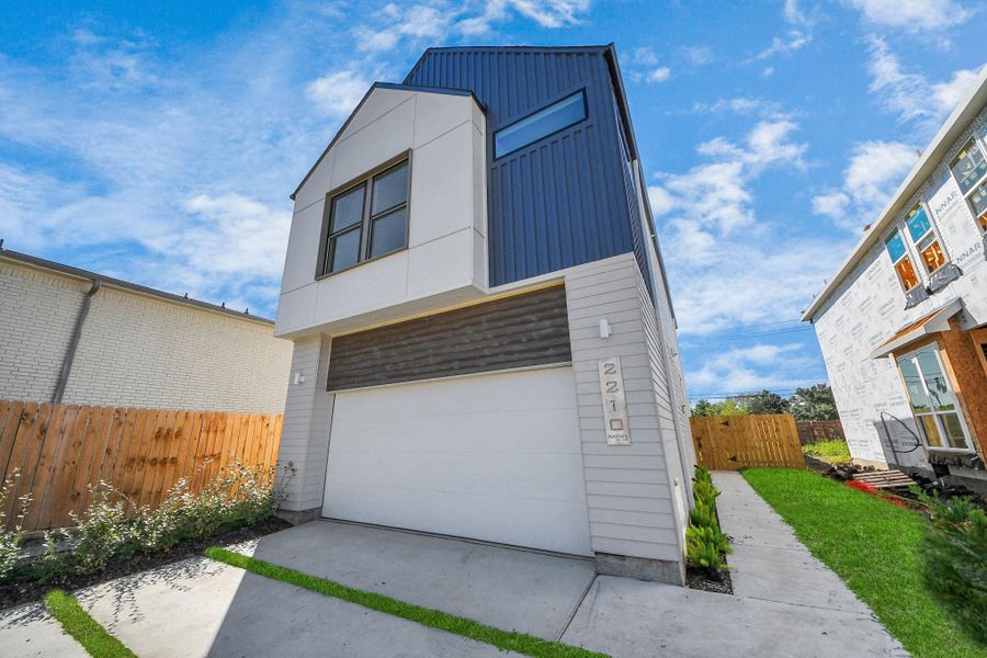 Front exterior of a new home in Piccolina, Houston, TX, highlighting curb appeal (Image 2).