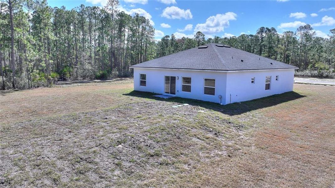 Exterior details and patio area of a home in , Indian Lake Estates (Image 20).