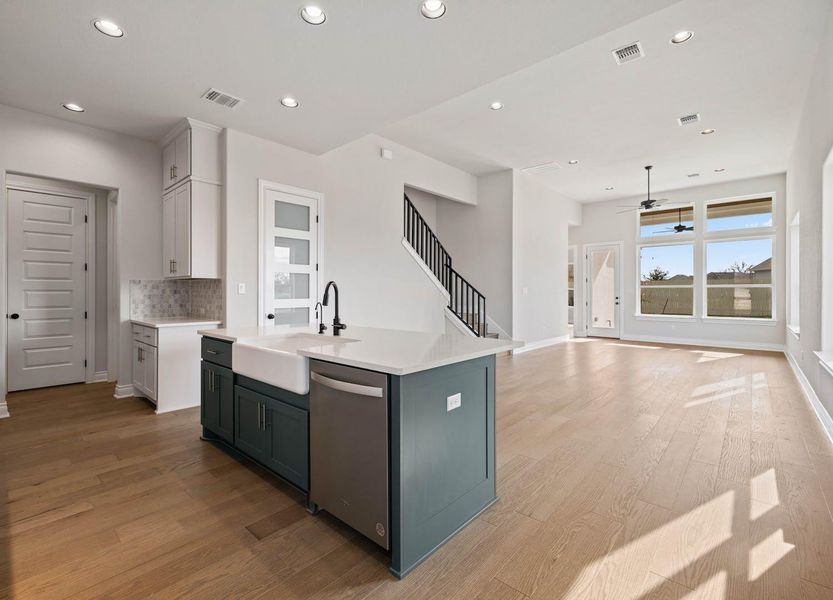 Kitchen featuring visible vents, stainless steel dishwasher, recessed lighting, and a sink Kitchen featuring visible vents, stainless steel dishwasher, recessed lighting, and a sink
