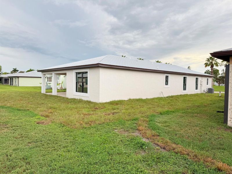Front exterior of a new home in , Port St. Lucie, FL, highlighting curb appeal (Image 11).