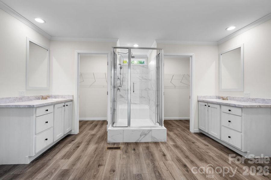 Primary bath with double vanities, 2 walk in closets and a linen closet