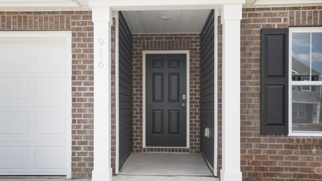 Exterior details and patio area of a home in Lakestone, Woodruff (Image 4). Exterior details and patio area of a home in Lakestone, Woodruff (Image 4).