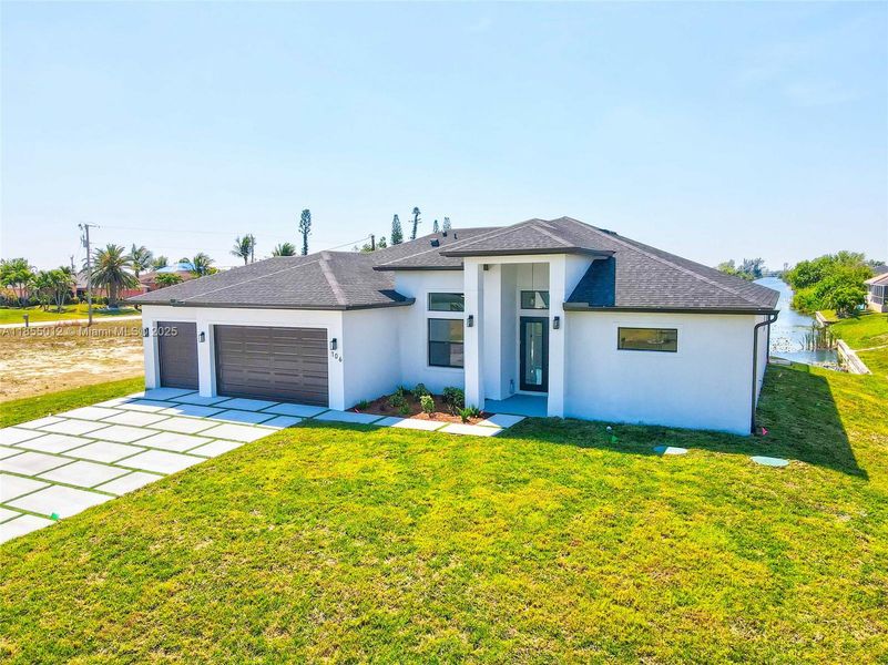 Front exterior of a new home in , Cape Coral, FL, highlighting curb appeal (Image 28).