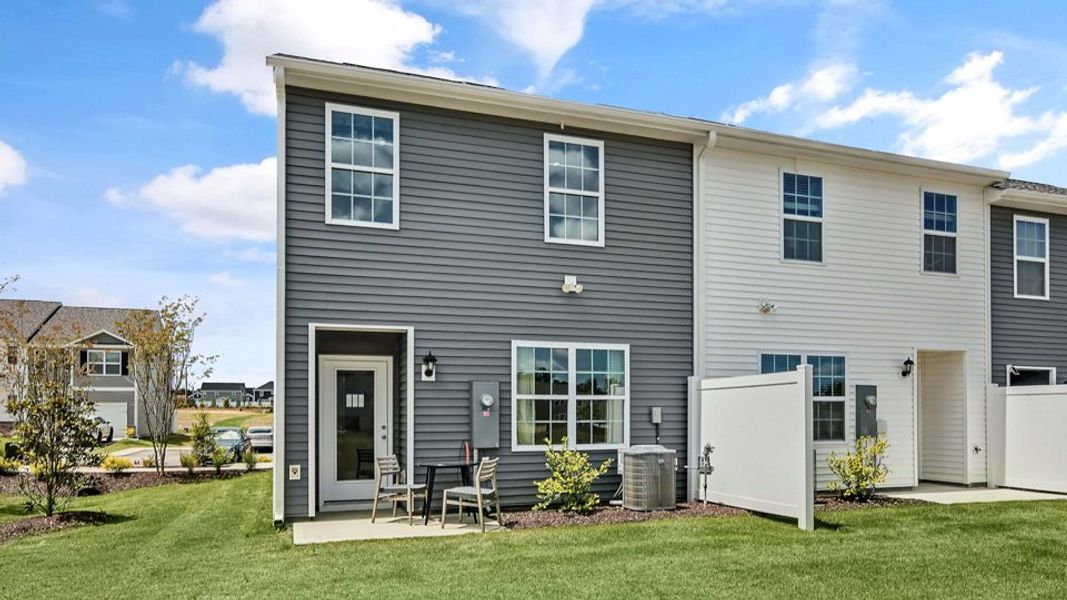 Representative exterior photo of a completed home built from the PEARSON by D.R. Horton in The Townes at Prestleigh, Wake Forest, NC (Image 22).