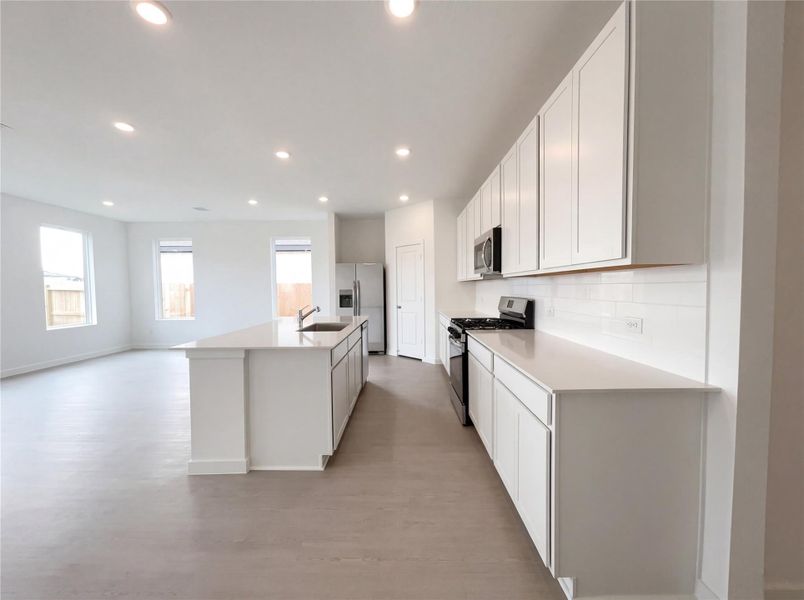 Furnished interior view inside a new home in Sunterra, Katy (Image 5).