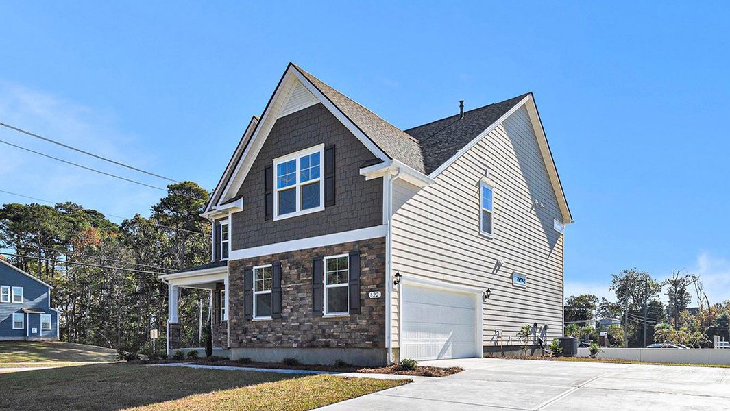 Front exterior of a new home in Belle Park, North Myrtle Beach, SC, highlighting curb appeal (Image 2).