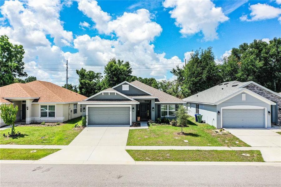 Front exterior of a new home in , Winter Haven, FL, highlighting curb appeal (Image 24).