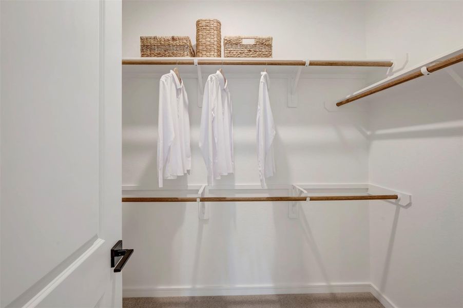 Primary walk-in closet (*Photo not of actual home and used for illustration purposes only.)