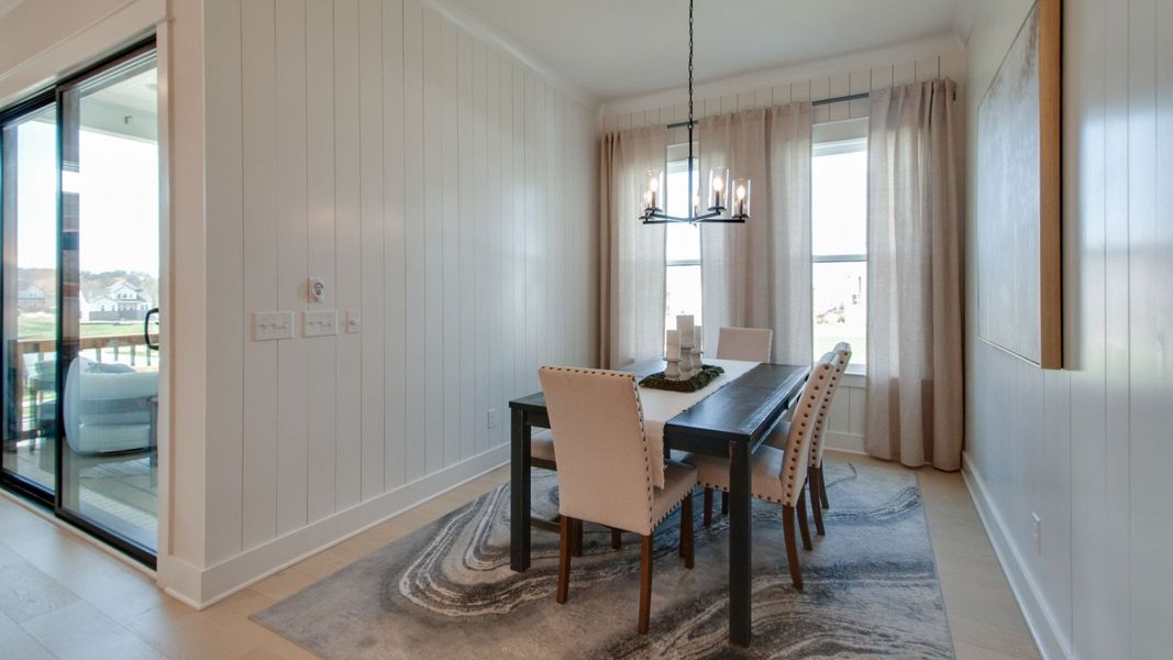 Dedicated dining area with large windows just off of the kitchen Dedicated dining area with large windows just off of the kitchen