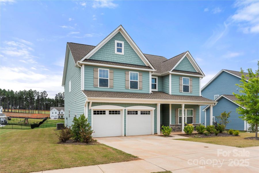 Front exterior of a new home in , Lancaster, SC, highlighting curb appeal (Image 21).