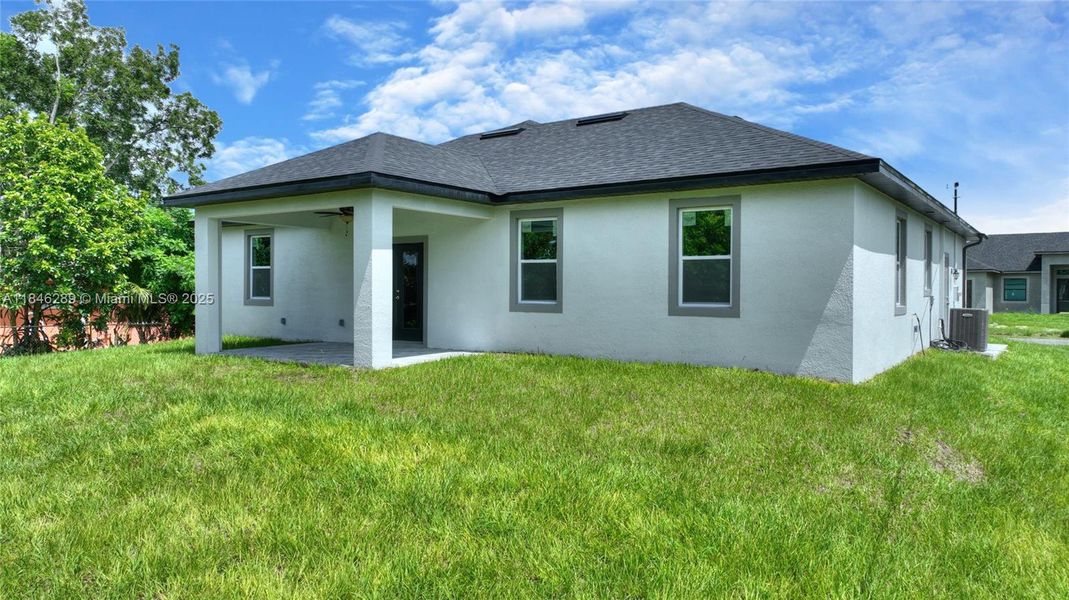 Front exterior of a new home in , Lehigh Acres, FL, highlighting curb appeal (Image 19). Front exterior of a new home in , Lehigh Acres, FL, highlighting curb appeal (Image 19).
