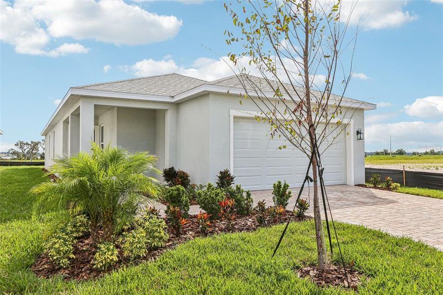 Front exterior of a new home in Willowbrook North, Winter Haven, FL, highlighting curb appeal (Image 20). Front exterior of a new home in Willowbrook North, Winter Haven, FL, highlighting curb appeal (Image 20).