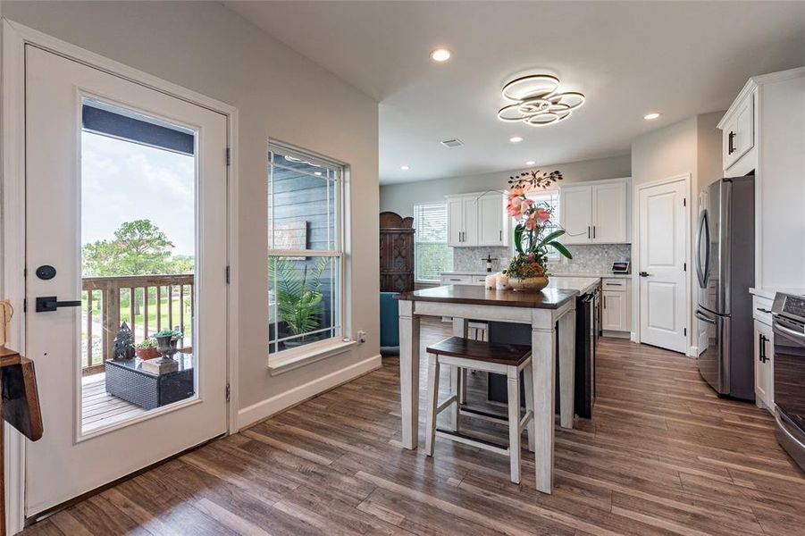 Positioned just to the left as you enter the home, the luxurious kitchen is a showstopper. Surrounded by large windows, this space is bathed in natural light and offers breathtaking views, creating an inspiring setting for cooking and entertaining.