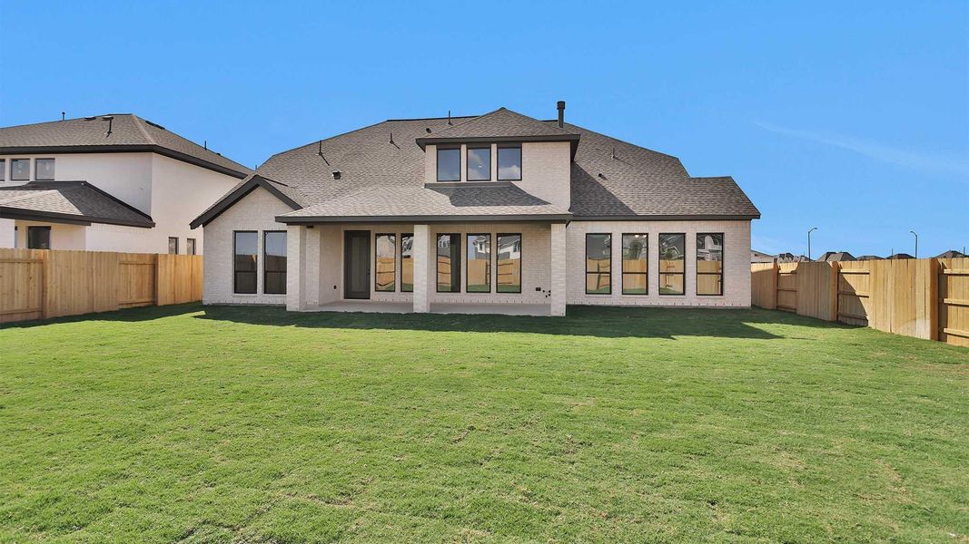 Exterior details and patio area of a home in Elyson 70', Katy (Image 4). Exterior details and patio area of a home in Elyson 70', Katy (Image 4).