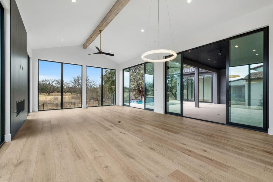 Spare room featuring light wood-style floors, ceiling fan, and recessed lighting