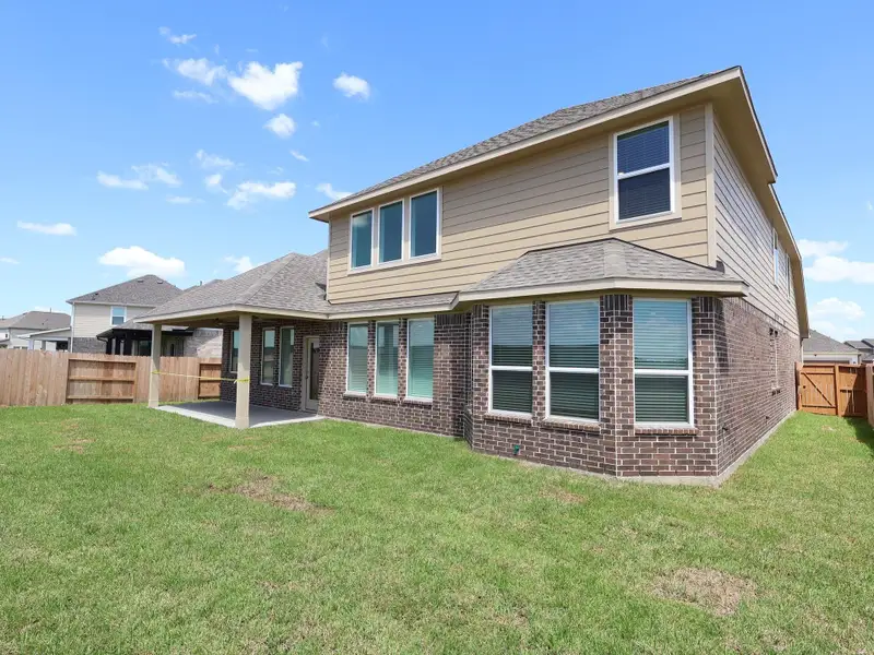 Front exterior of a new home in Marvida, Cypress, TX, highlighting curb appeal (Image 1). Front exterior of a new home in Marvida, Cypress, TX, highlighting curb appeal (Image 1).