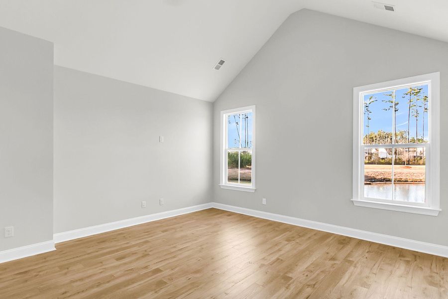 Spacious, unfurnished interior of a new home in Tidewater at Lakes of Cane Bay, Summerville (Image 36).