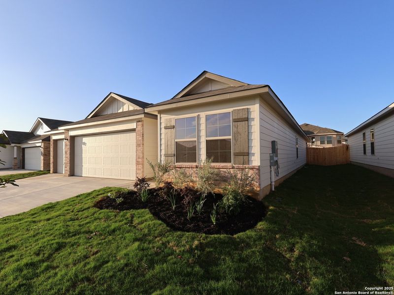 Front exterior of a new home in Greenspoint Heights, Seguin, TX, highlighting curb appeal (Image 23).